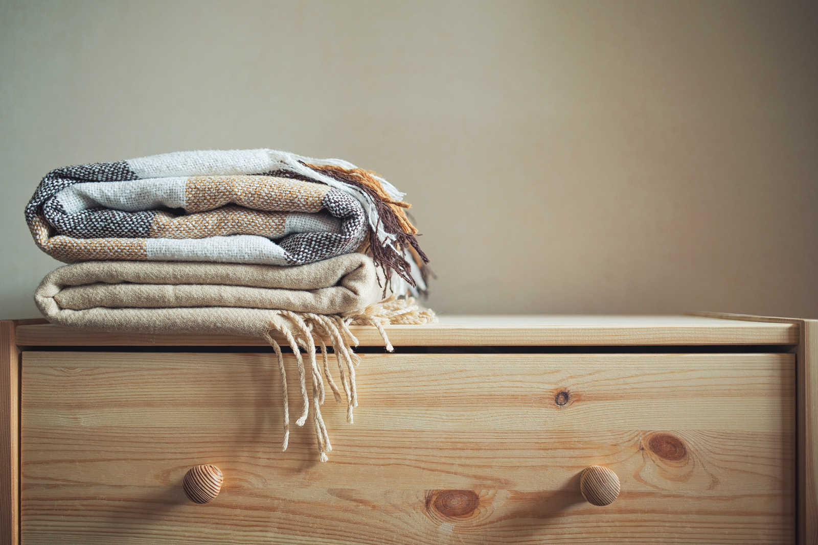 Onde e como guardar a roupa de cama no quarto